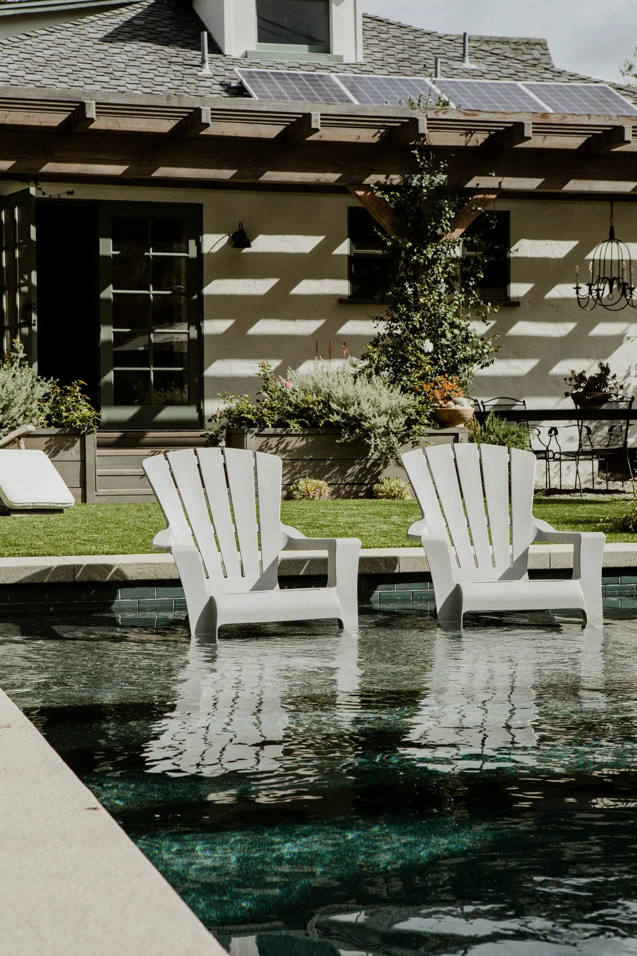 Pool tanning ledge with lounge chairs